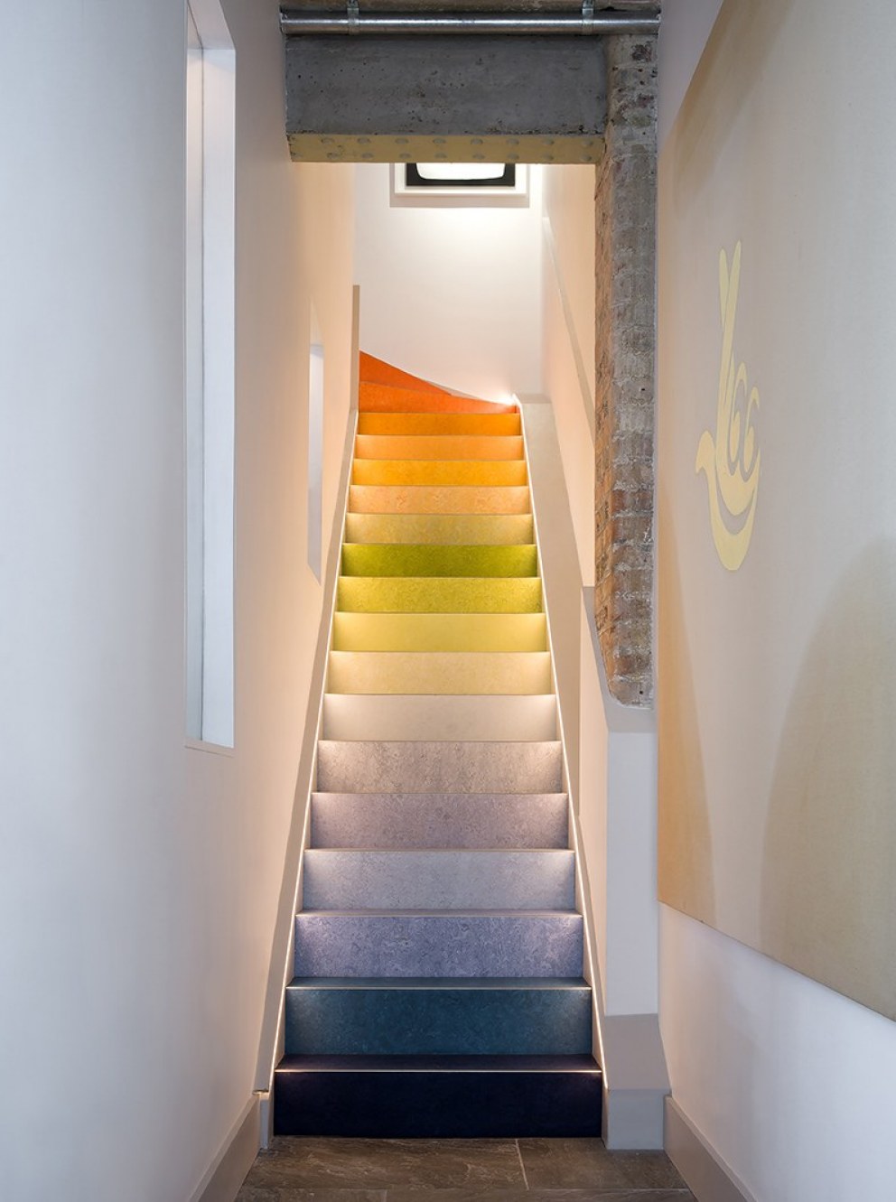 Avant garde Industrial Mews House | Colourful gradient linoleum stairs | Interior Designers